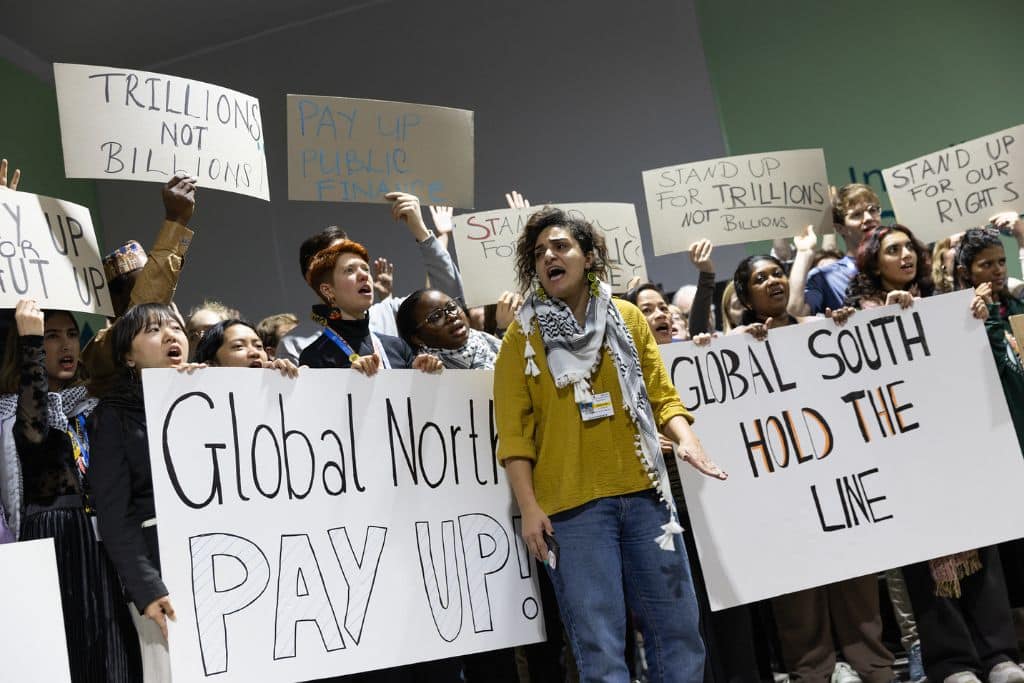 Protesters gather outside the COP29 negotiation hall on November 24, 2024.