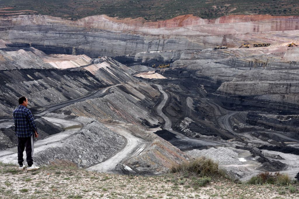 A man overlooks a coal mine in Spain.