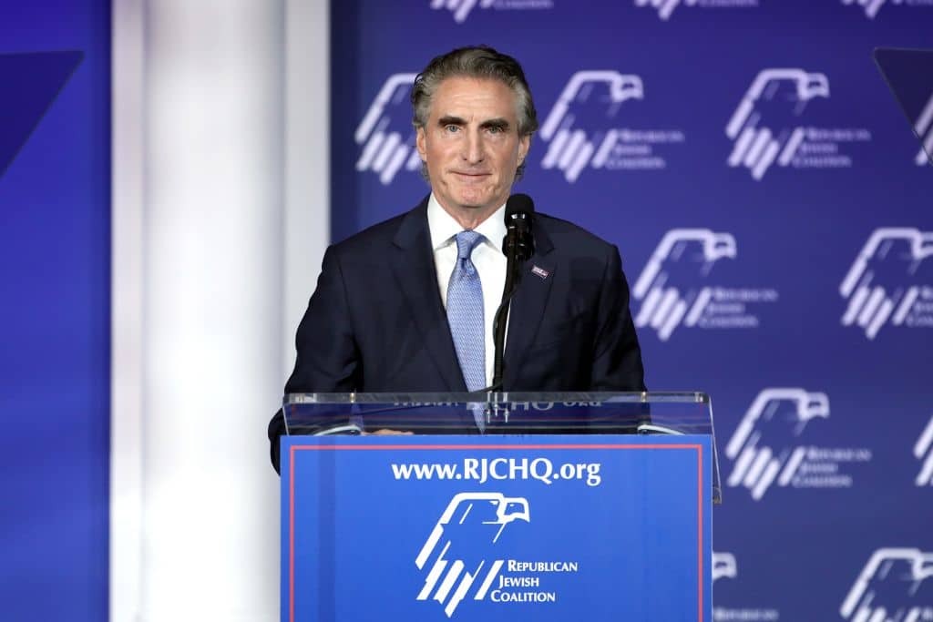 North Dakota Governor Doug Burgum speaking with attendees at the Republican Jewish Coalition's 2023 Annual Leadership Summit at the Venetian Convention & Expo Center in Las Vegas, Nevada.